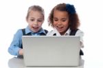 Little Girls Playing Games On Laptop Stock Photo