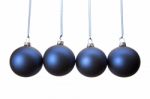 Four Blue Christmas Balls Hanging In Row Stock Photo