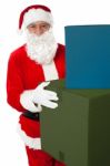 Photo Of Kind Santa Claus Giving Xmas Presents Stock Photo