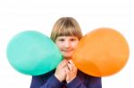 Young Dutch Girl Holding Two Colorful Balloons Stock Photo