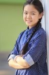 Portrait Of Thai 12s Years Girl Wearing Blue Shirt Standing Out Door With Toothy Smiling Face Happiness Emotion Stock Photo