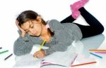 Little Girl Writing Homework And Having Trouble Doing It Stock Photo