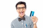 Laughing Guy Holding Credit Card Stock Photo