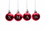 Word Xmas On Red Christmas Balls Hanging On White Background Stock Photo