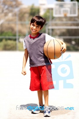 Adorable Boy With Basketball Stock Photo