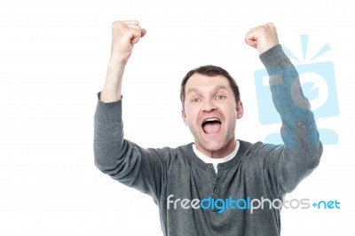 Casual Man Winning And Celebrating Stock Photo