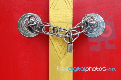 Colorful Thai Style Temple Door With Chain Locked Stock Photo