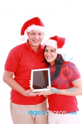 Couple With Touchpad On Christmas Stock Photo