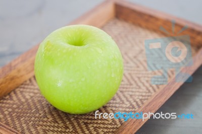 Download Green Apple On Wooden Tray Stock Photo Royalty Free Image Id 100356876 Yellowimages Mockups