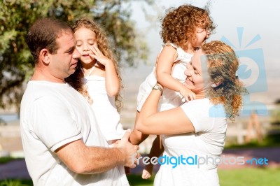 Parents With Two Kids Stock Photo