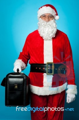 Santa Holding Brand New Briefcase Stock Photo