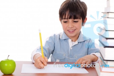 School Boy Doing His Homework Stock Photo