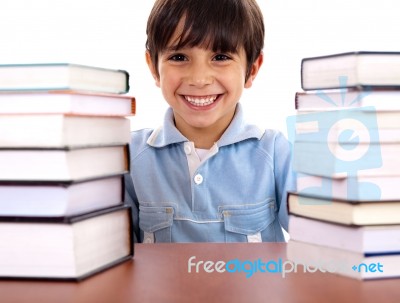 School Boy Surrounded By Books Stock Photo