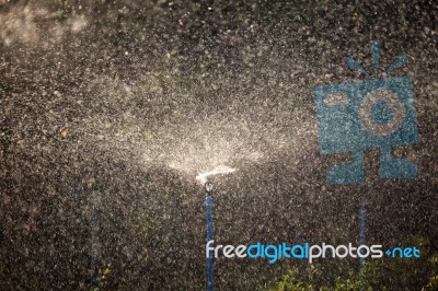 Water Sprinkler Background Stock Photo