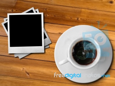White Cup Of Hot Coffee And Photo Frame Stock Photo