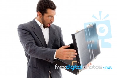 Young Man Surprised After Looking His Empty Bag Stock Photo