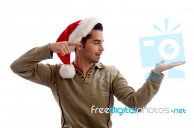 Young Man Wearing Christmas Hat Stock Photo