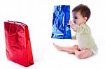 Baby Holding The Shopping Bag Stock Photo