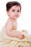 Baby Wrapped In Bath Towel Stock Photo