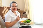 Fat Woman Eating Salad Stock Photo