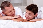 Father And Son Looking Into Each Others Eyes Stock Photo