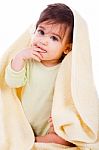 Innocent Baby Wrapped With A Yellow Towel Stock Photo