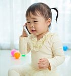 Little Girl Talking On Mobile Phone Stock Photo