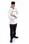 Male Chef Standing With Clipboard Stock Photo