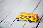 Minimal School Bus On Wooden Panel Stock Photo
