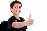 Side Pose Of Teenager Shows Thumbs Up Stock Photo