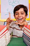 Smiling Young Student Pointing Up Stock Photo