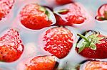 Strawberry In Water Background Stock Photo