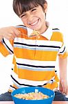 Young Boy Eating His Breakfast Stock Photo