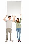 Young Couples Holding Blank Board Stock Photo