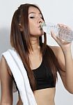 Young Girl Drinking Water Stock Photo