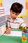 Young Kid Busy In Drawing Stock Photo