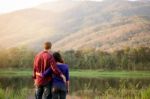 Happy Smiling Romantic Couple Relaxing In Love At The Autumn Bea Stock Photo