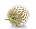 Cantaloupe In Net Bag, Isolated On White Background Stock Photo