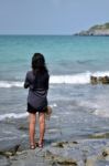 Lonely Woman On The Beach Stock Photo