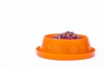 Dry Cat Food In Orange Bowl Isolated On White Background Stock Photo