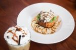 Honey Toast With Banana And Ice Coffee Stock Photo