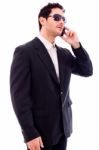 Handsome Young Business Man Talking On Phone Stock Photo