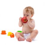 Cute Infant Boy With Apple Stock Photo