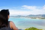 Woman Tourist Watching The Ocean In Phuket, Thailand Stock Photo