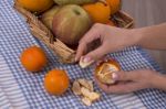 Woman Hands Peeling A Mandarin Stock Photo