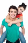 Male Giving Piggyback Ride Stock Photo