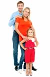 Full Length Portrait Of Adorable Caucasian Family Stock Photo