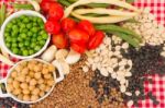 Variety Of Kitchen Ingredients With Fresh And Dried Legumes Stock Photo