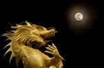 Chinese Dragon And Full Moon Stock Photo