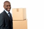 African Corporate Man Holding Card Box Stock Photo